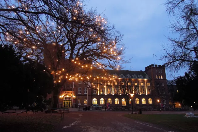 The AF-Castle, centre for student activities, behind a tree lit by christmas decoration and early December morning. Photograph by Louise Larsson.