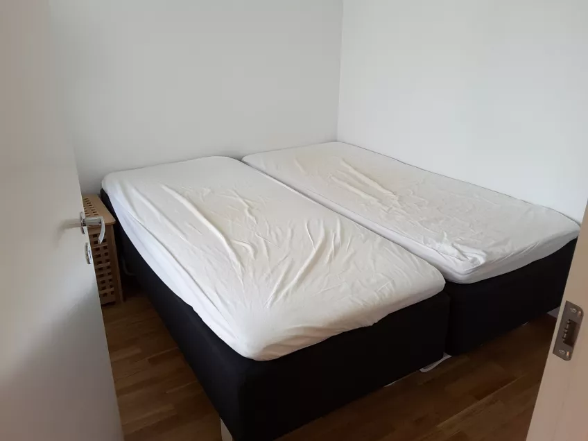 Overview in the bedroom of apartment 1202 at the housingarea Sofieberg showing two beds.