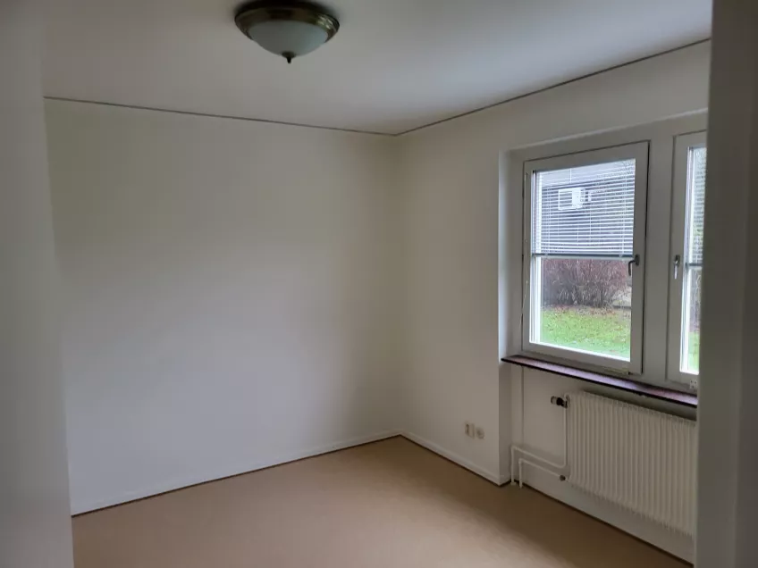 View of an empty bedroom with a window. Photo: Mikko Jokela Måsbäck